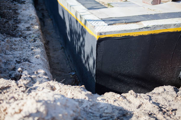 Professional Basement Waterproofing technician working in Germantown, TN